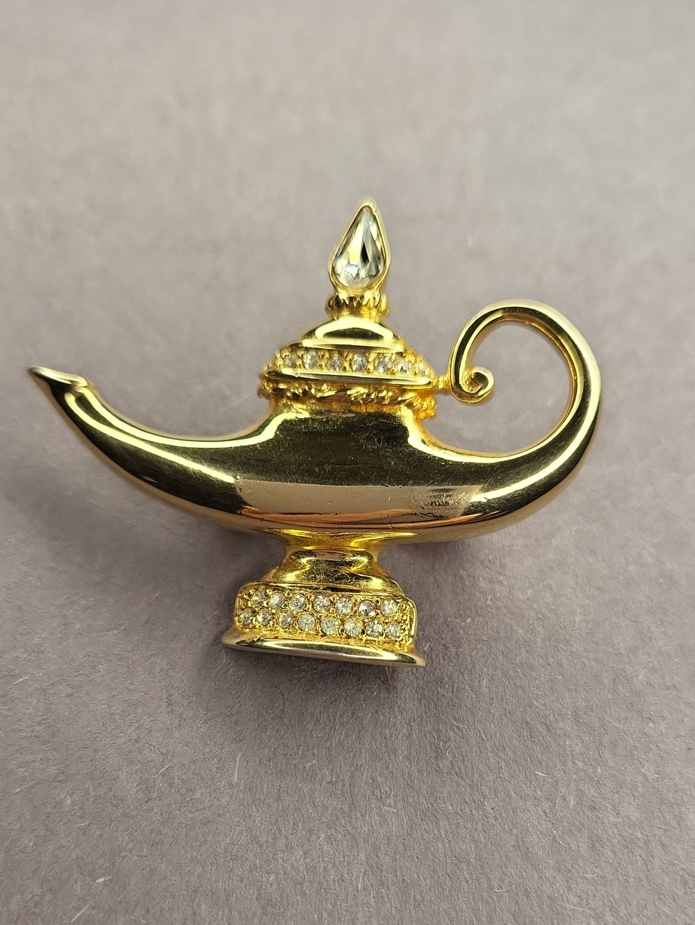 Gold-tone Aladdin Lamp Brooch with Clear Crystals